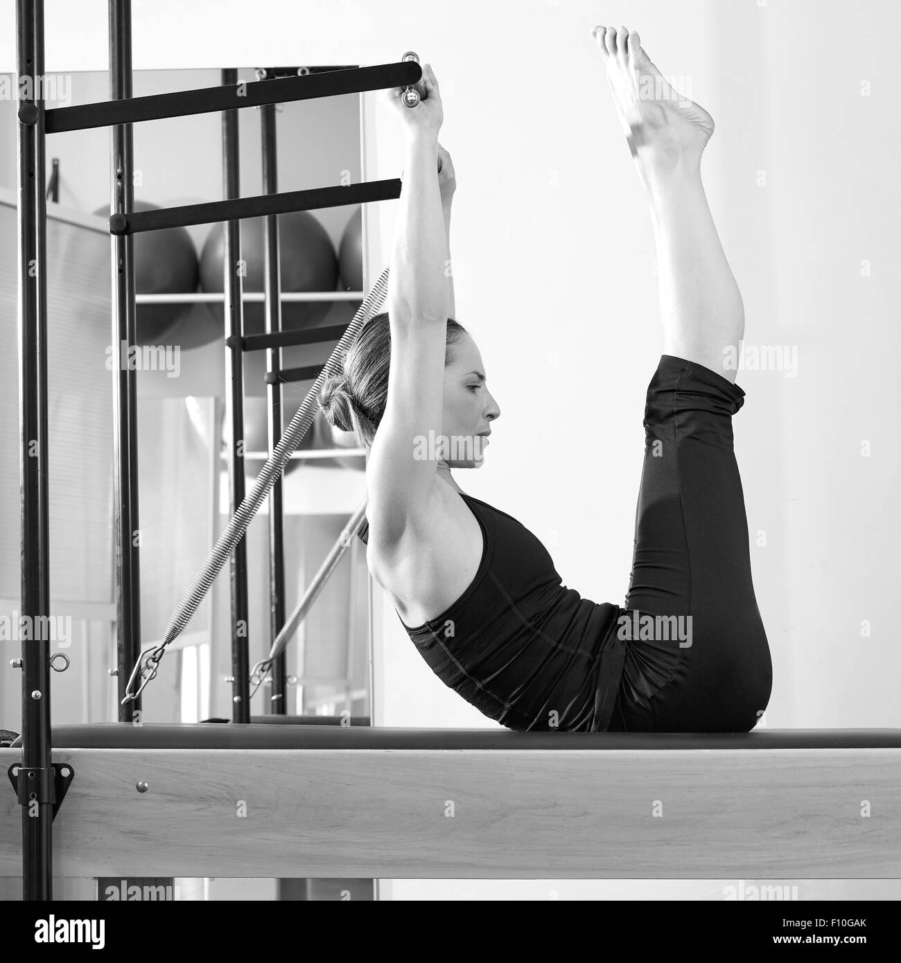 Pilates woman in cadillac acrobatic hi-res stock photography and