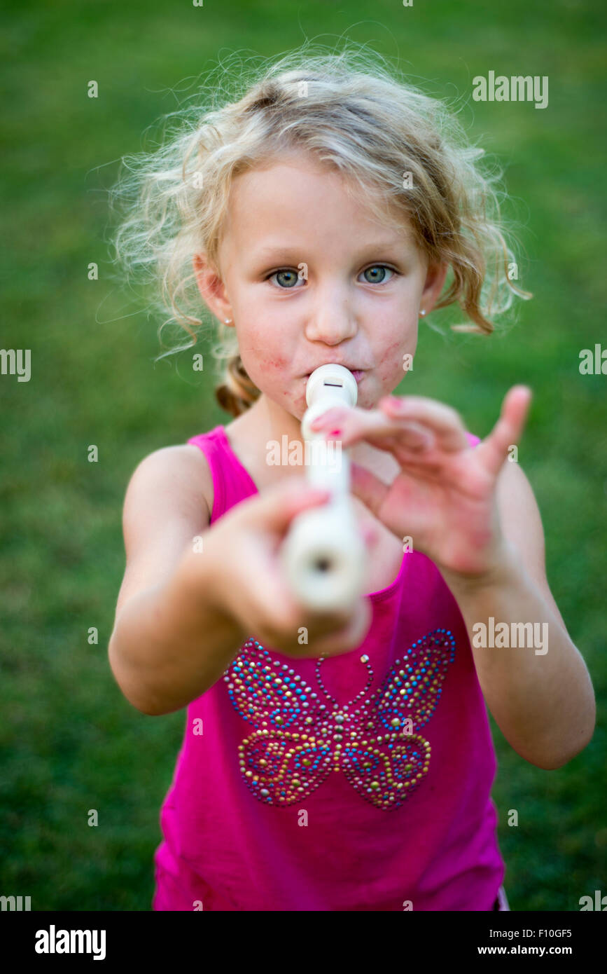 Child Blond Girl Playing Flute Recorder, outdoor Portrait at backyard Stock Photo Alamy