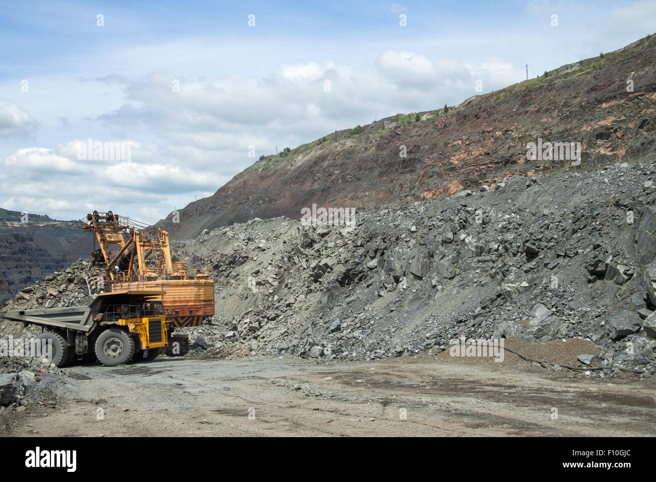 Dump truck being loaded with iron ore on the opencast Stock Photo Alamy