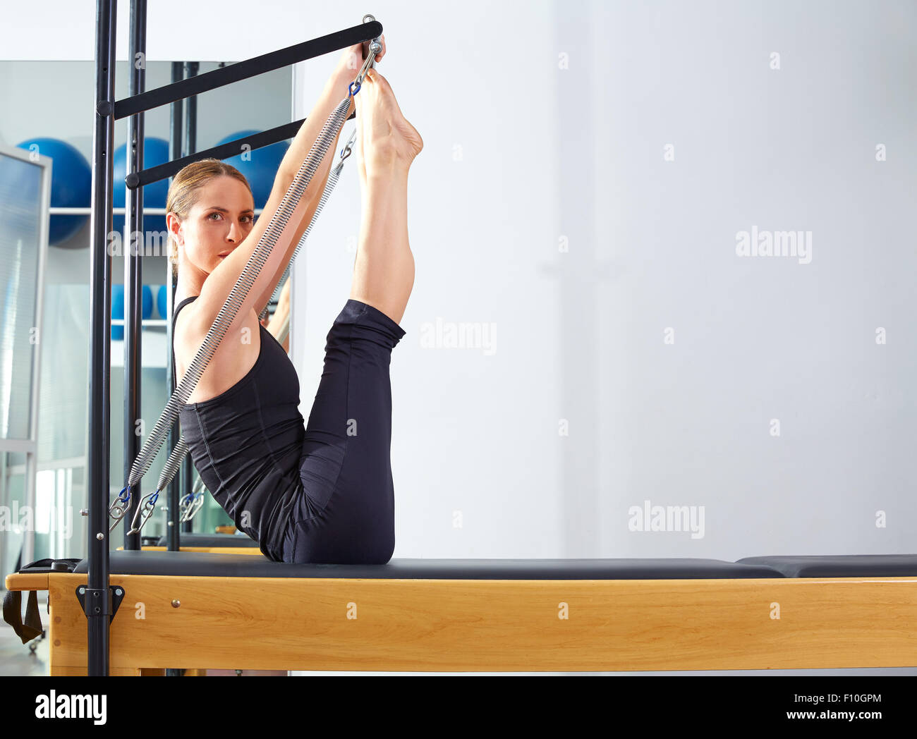 Pilates woman in cadillac acrobatic hi-res stock photography and