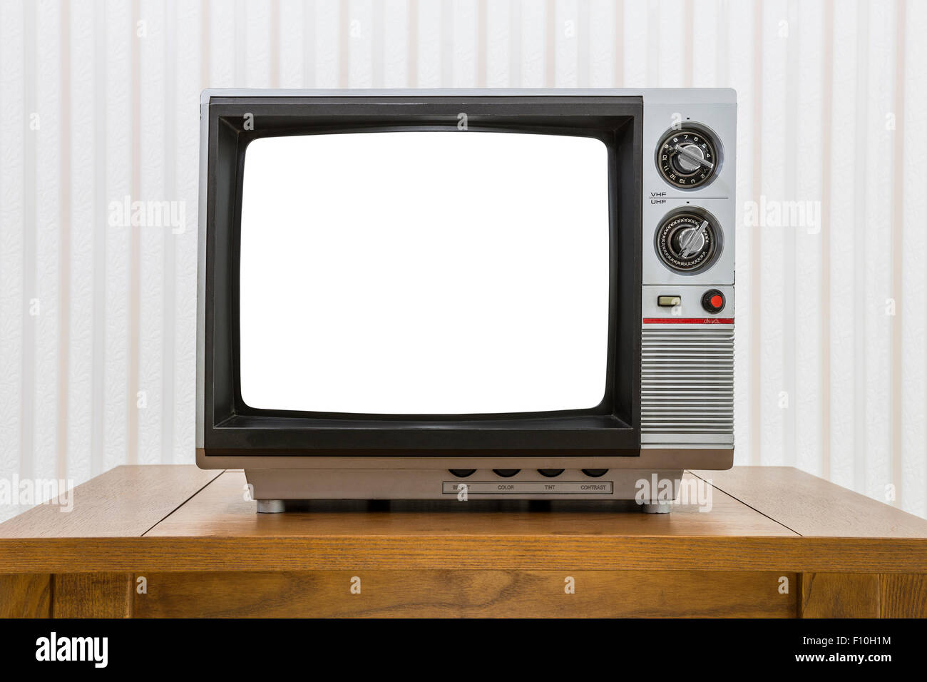 Vintage portable television on old craftsman style table with cut out