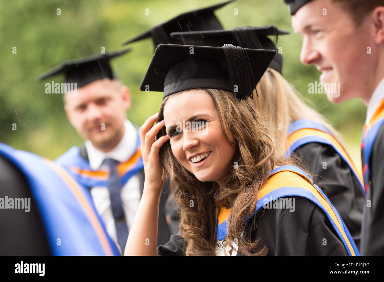 young University graduating students in cap and gown Stock Photo - Alamy