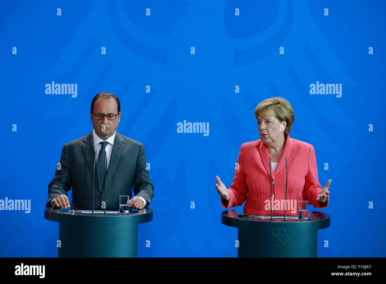 Berlin, Germany. 24th Aug, 2015. Angela Merkel, German Chancellor and François Hollande, French president give a joint Press Statements before meeting in Berlin, Germany on 24 August 2015: / Picture: Angela Merkel, German Chancellor and François Hollande, French president. Credit:  Reynaldo Chaib Paganelli/Alamy Live News Stock Photo