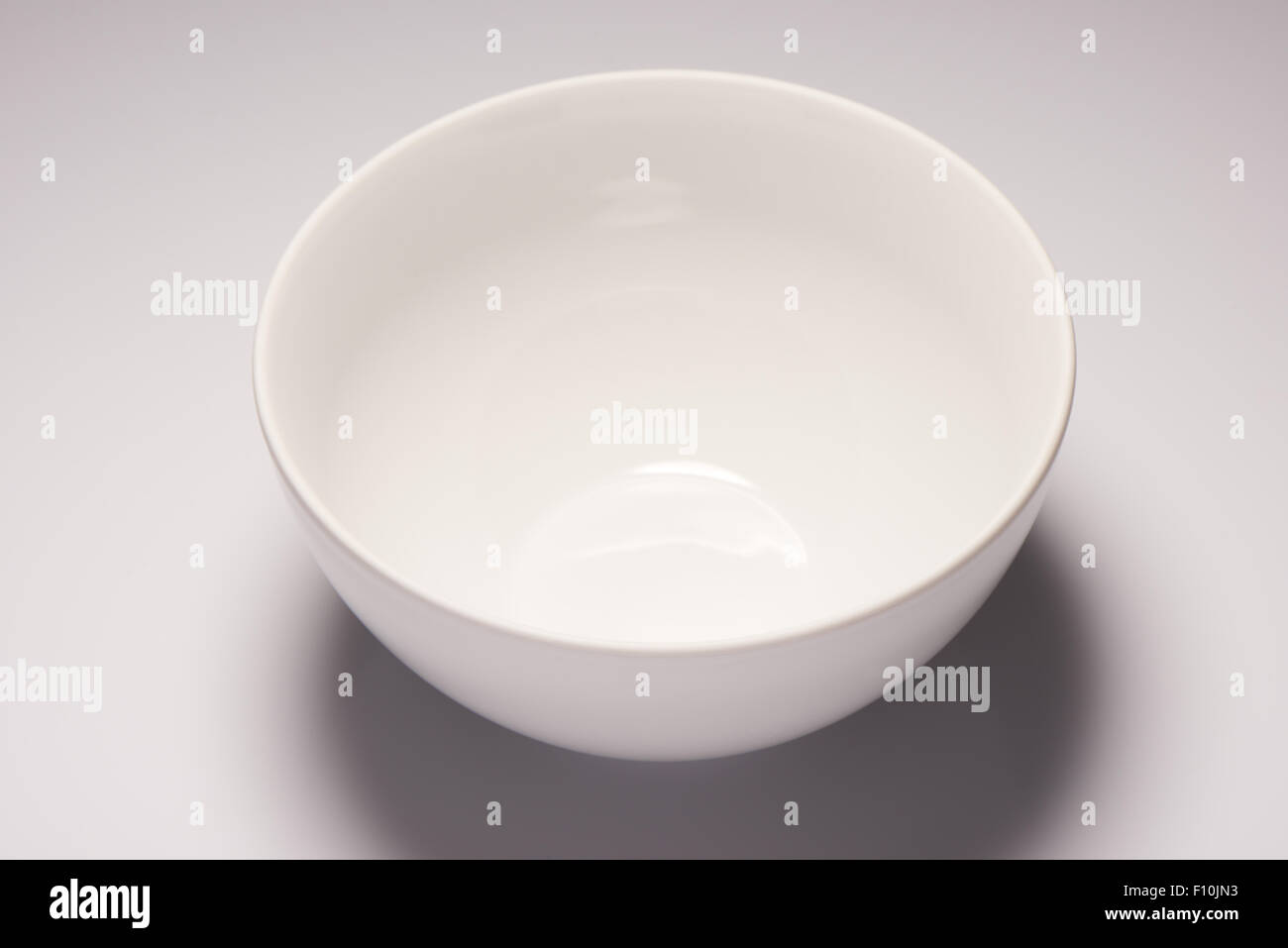 White empty ceramic bowl on white background Stock Photo