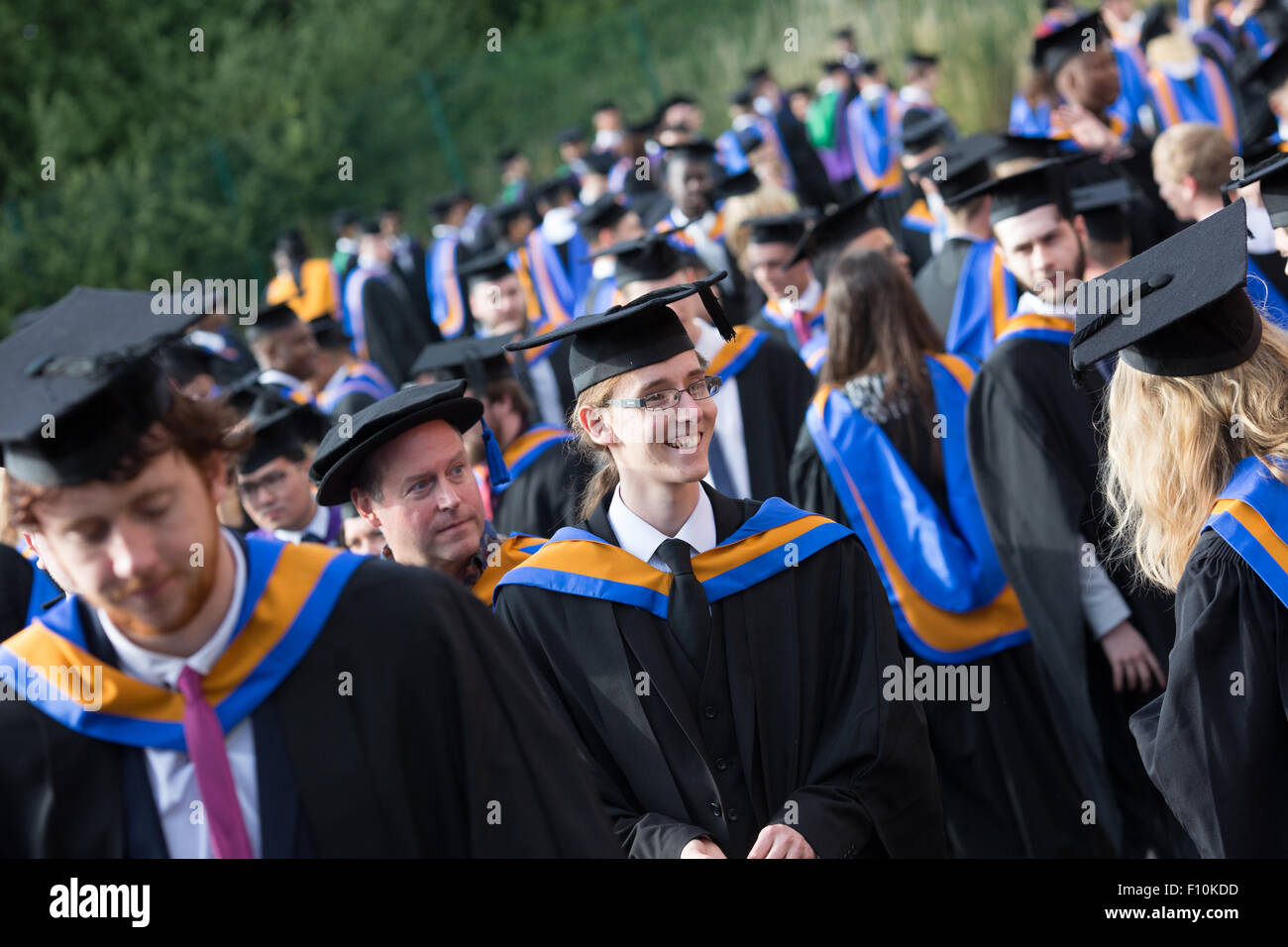 Graduation happy students wearing gown hi-res stock photography and ...