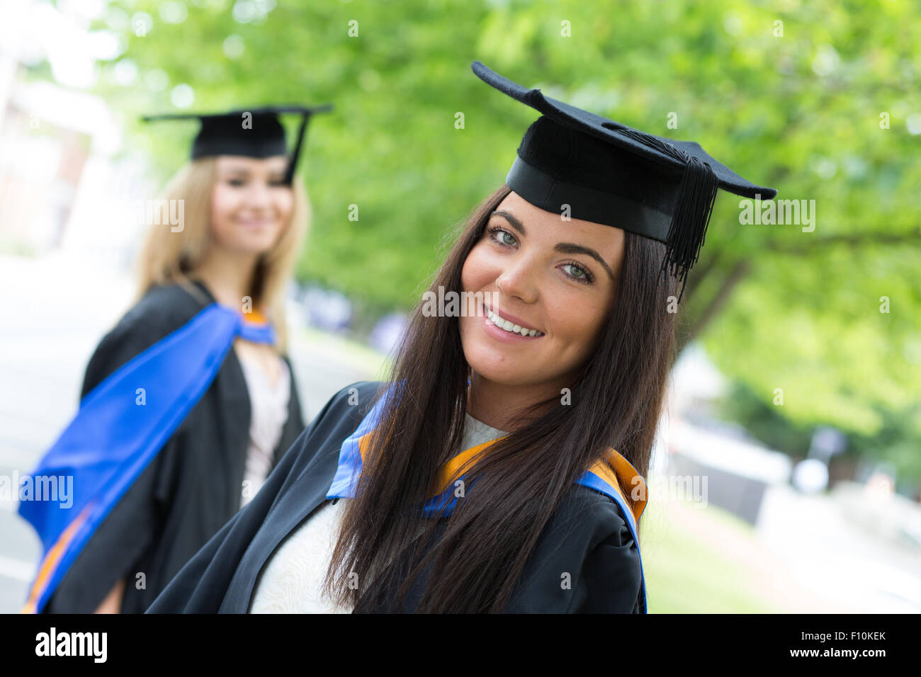 Female College Graduate in Cap and Gown Stock Photo - Image of