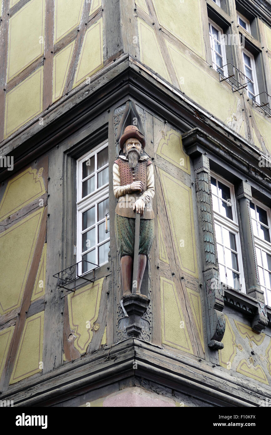 Wooden statue at a house in Colmar, Elzas, France Stock Photo