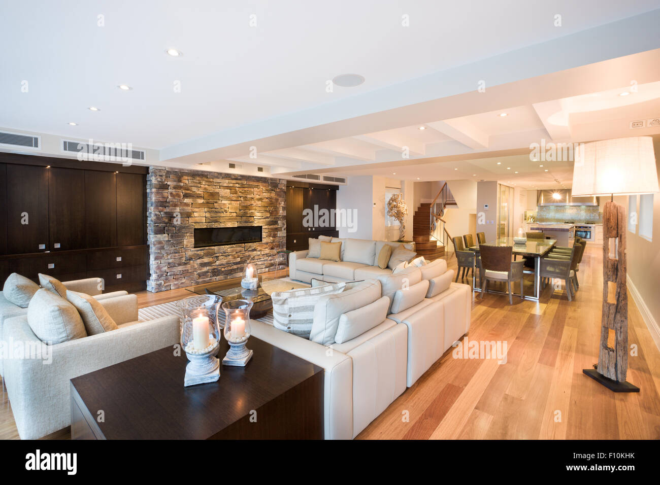 Beautiful living room with three sofas and a luxurious wooden floor