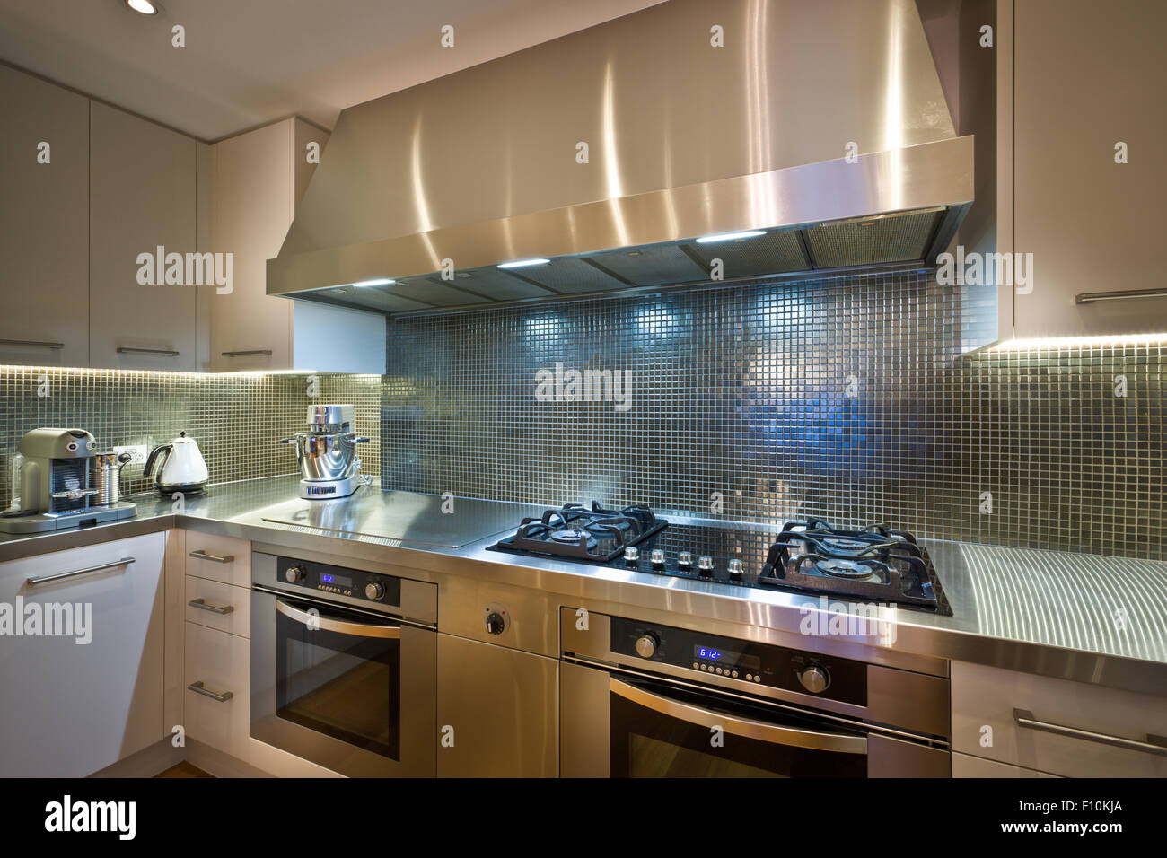 Two kitchen ovens, both gas and electric, installed in a modern kitchen