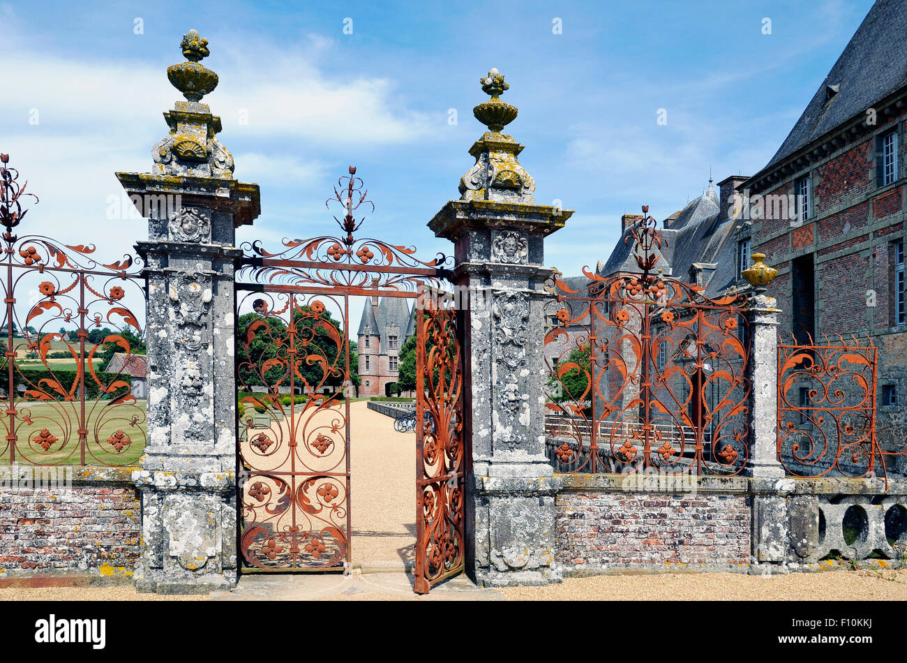 Ornate iron gates at the Château de Carrouges, an unusual brick built castle in Carrouges, Basse Normandie, France. Stock Photo