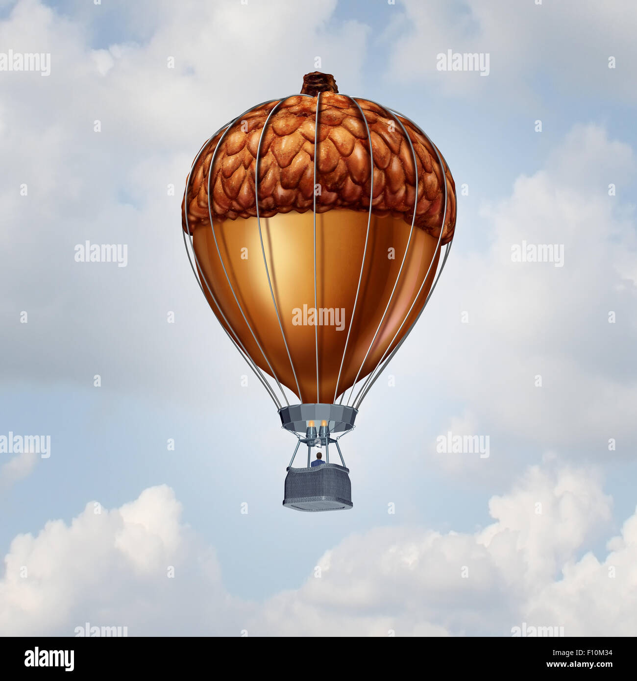 Investment rise and growth concept as an acorn nut shaped as an air balloon as a financial business metaphor for rising economy Stock Photo