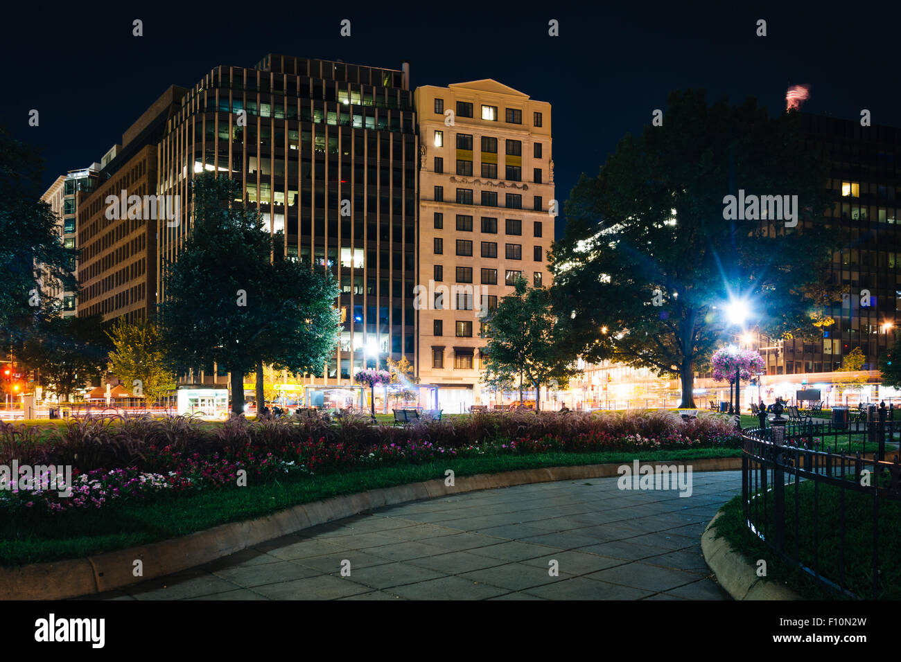 Walkway and buildings at night, at Farragut Square, in Washington, DC. Stock Photo