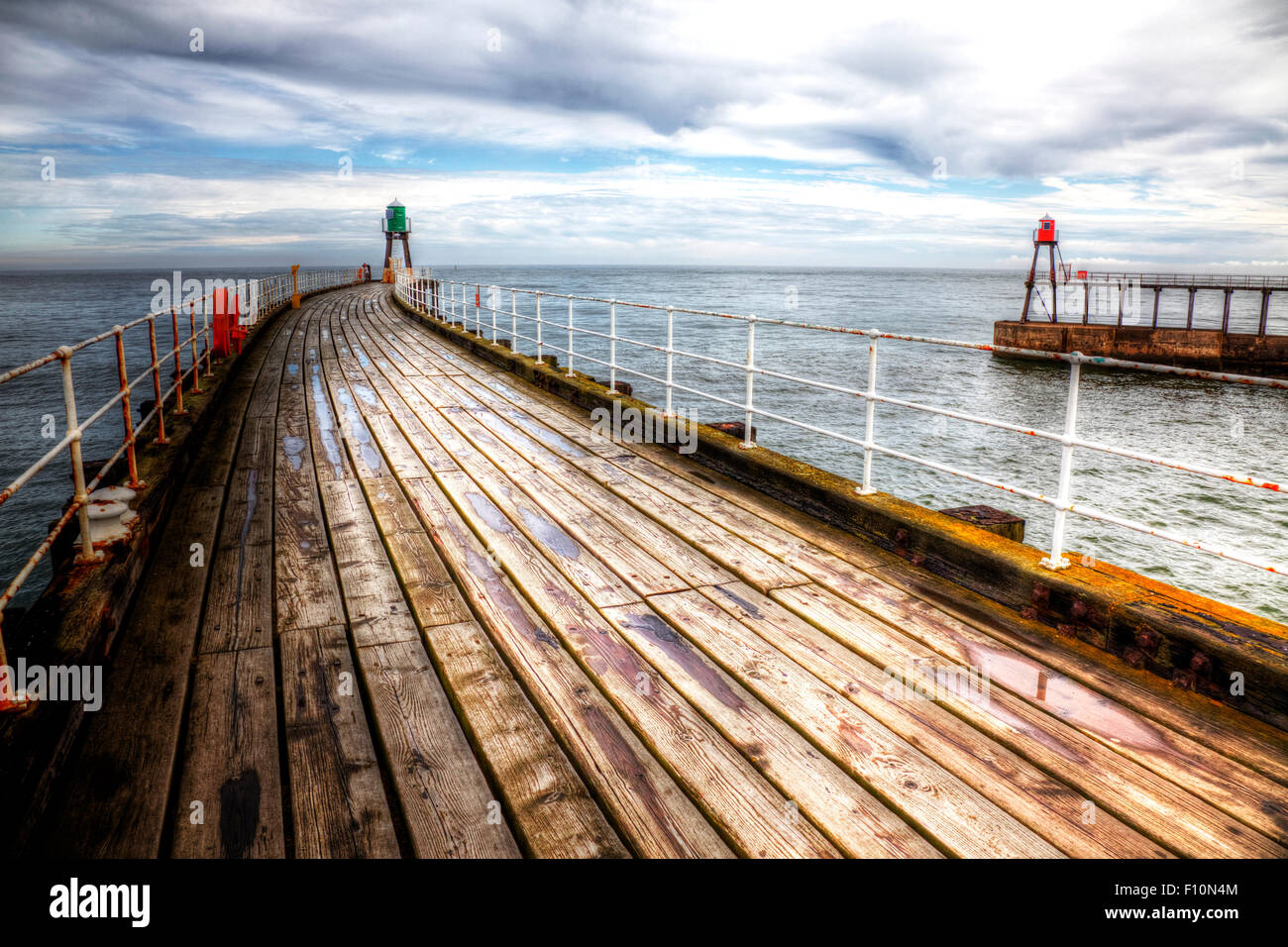Whitby pier harbour wall harbor wooden floor out to sea coast coastal
