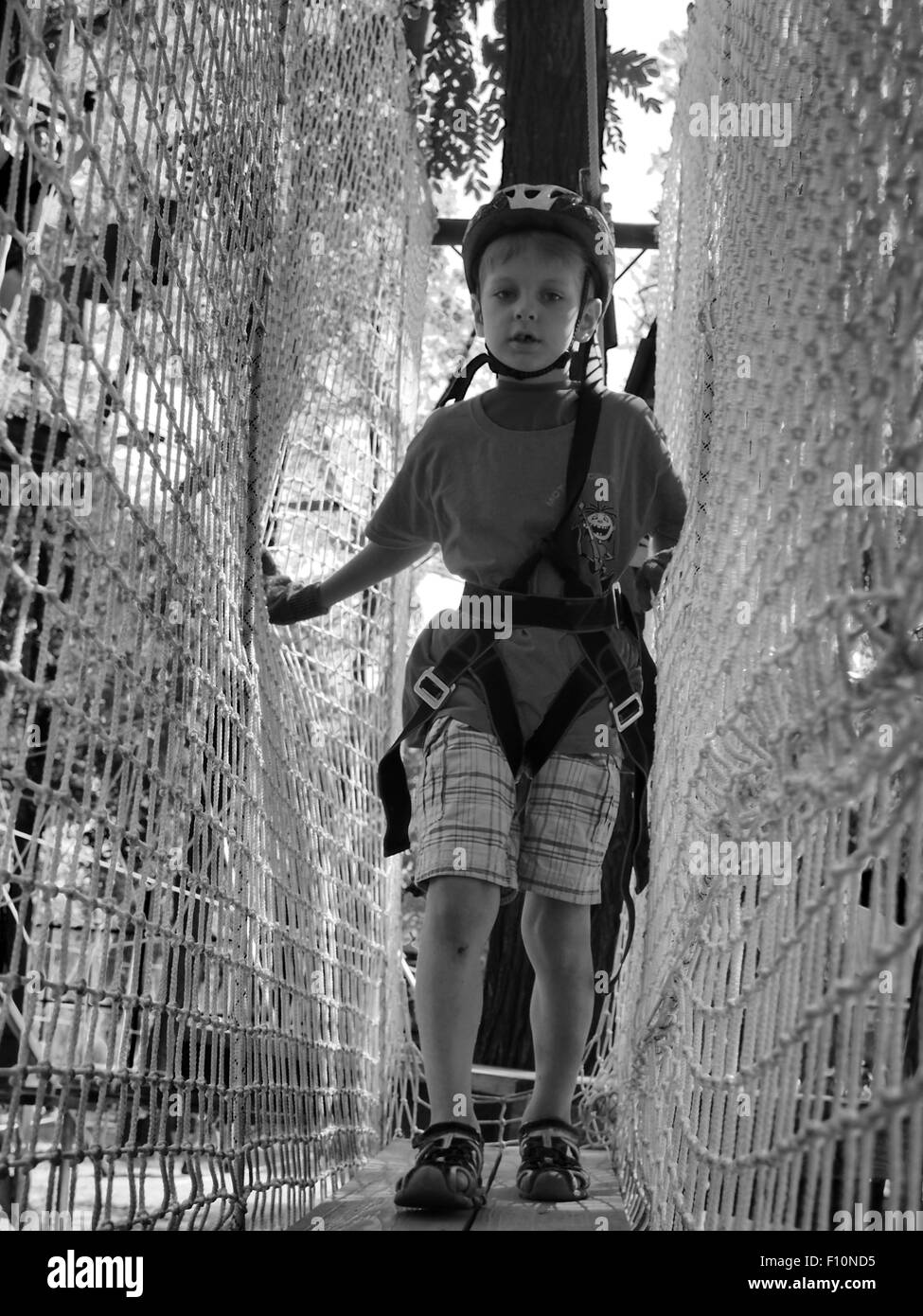 Kiev, Ukraine. 24th Aug, 2015. Boy playing on the bungee in the suburbs of Kiev Borispol. -- Thousands of Ukrainians celebrate the 24 anniversary of Independence of Ukraine mass festivities in towns and villages across the country. This holiday marred by Russian aggression in the east of Ukraine and the occupation of the Crimea. Ukrainians are hoping that 25 Independence Day they will meet in a more peaceful environment. © Igor Golovnov/Alamy Live News Stock Photo