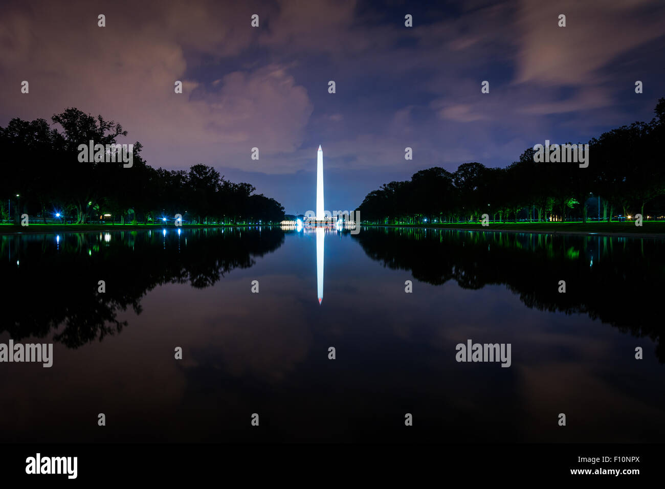 The Washington Monument and Reflecting Pool at night, at the National Mall, in Washington, DC. Stock Photo