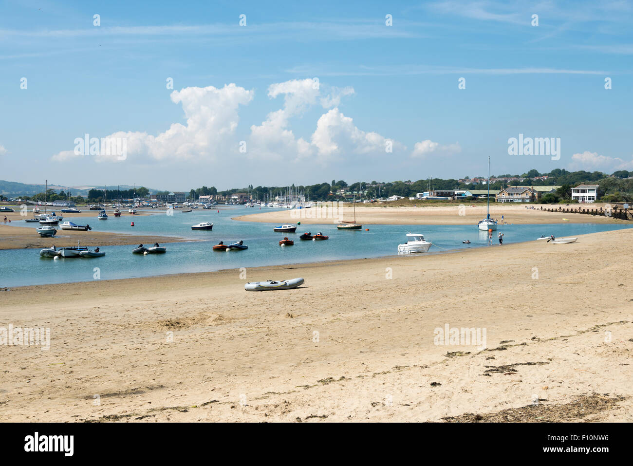 Boats moored off the beach in the estuary at Bembridge Isle of Wight UK