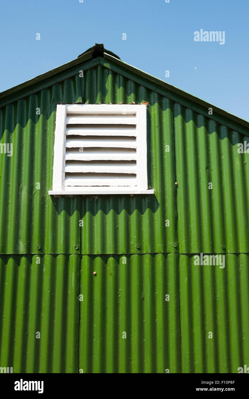 Abstract Close Up Of A Green Painted Corrugated Iron Shed At