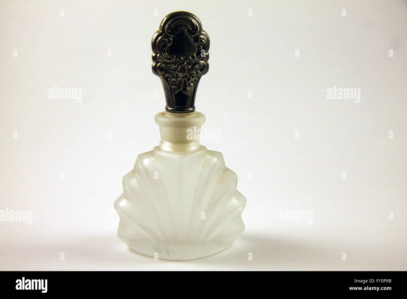 Crystal perfume bottle with carved silver stopper Stock Photo Alamy