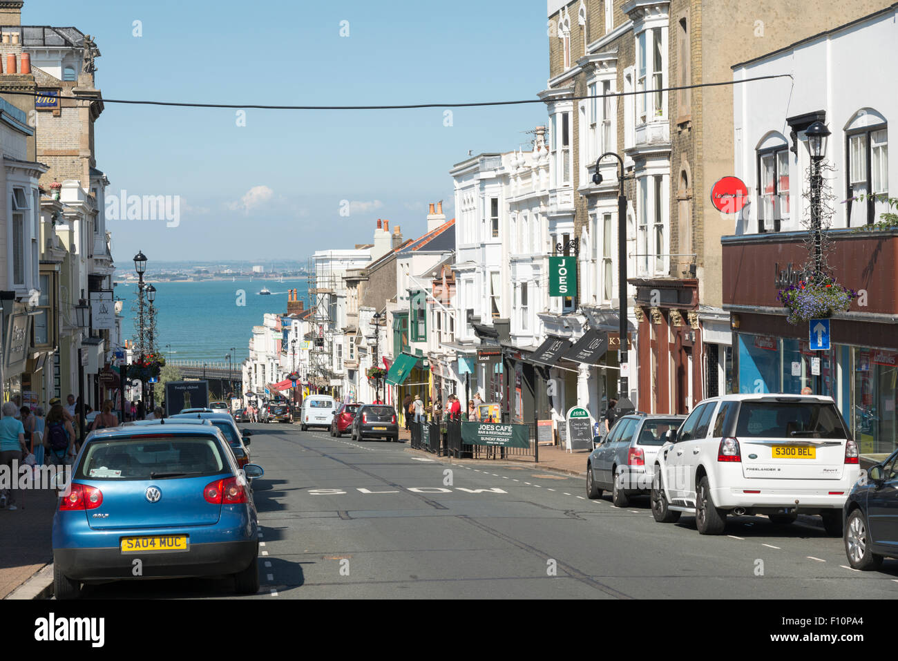 Shops in Union Street, Ryde, Isle of Wight UK in summer, with cars parked on the road. Stock Photo