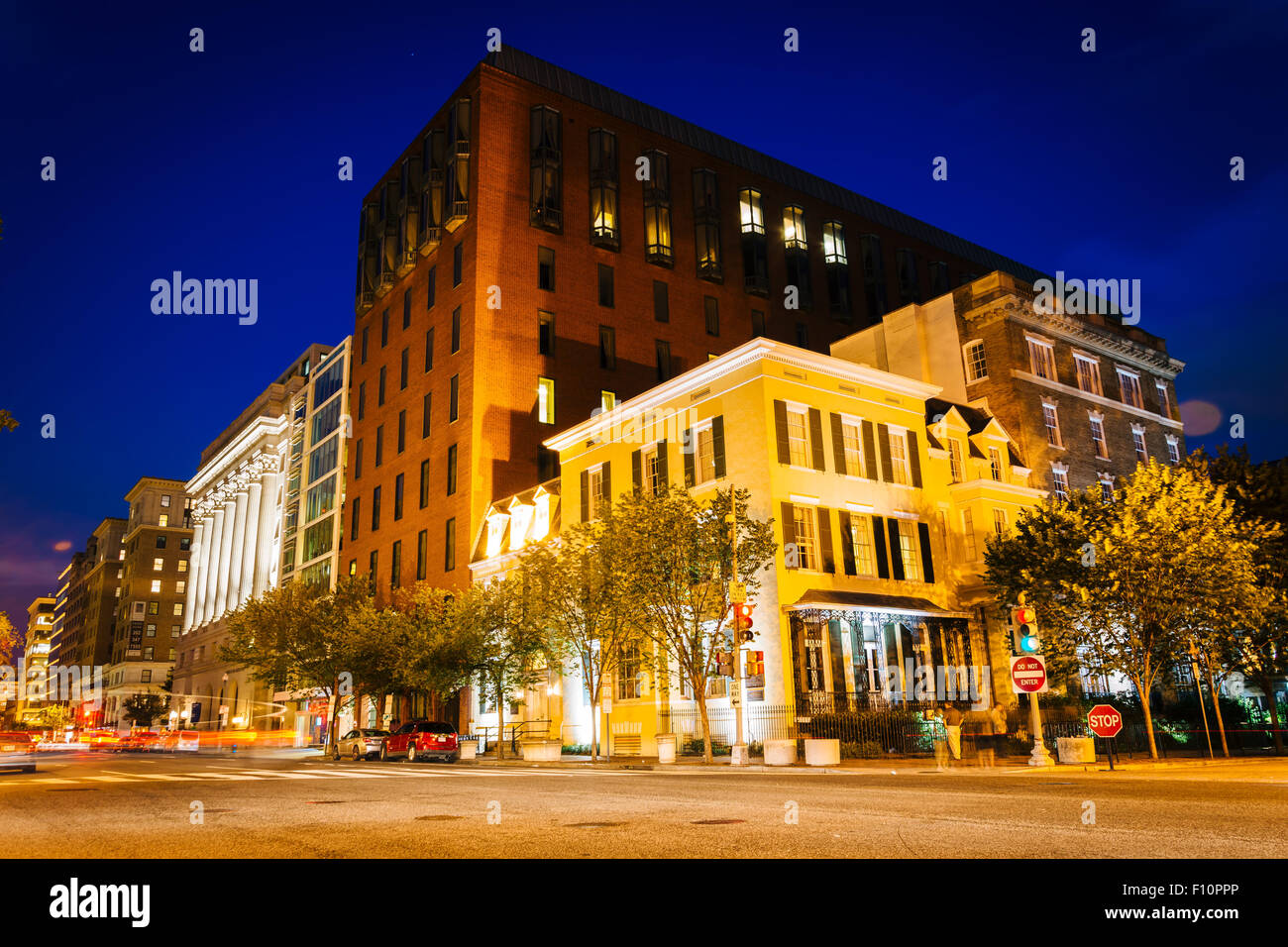 Buildings at H Street and Vermont Avenue at night, in Washington, DC. Stock Photo