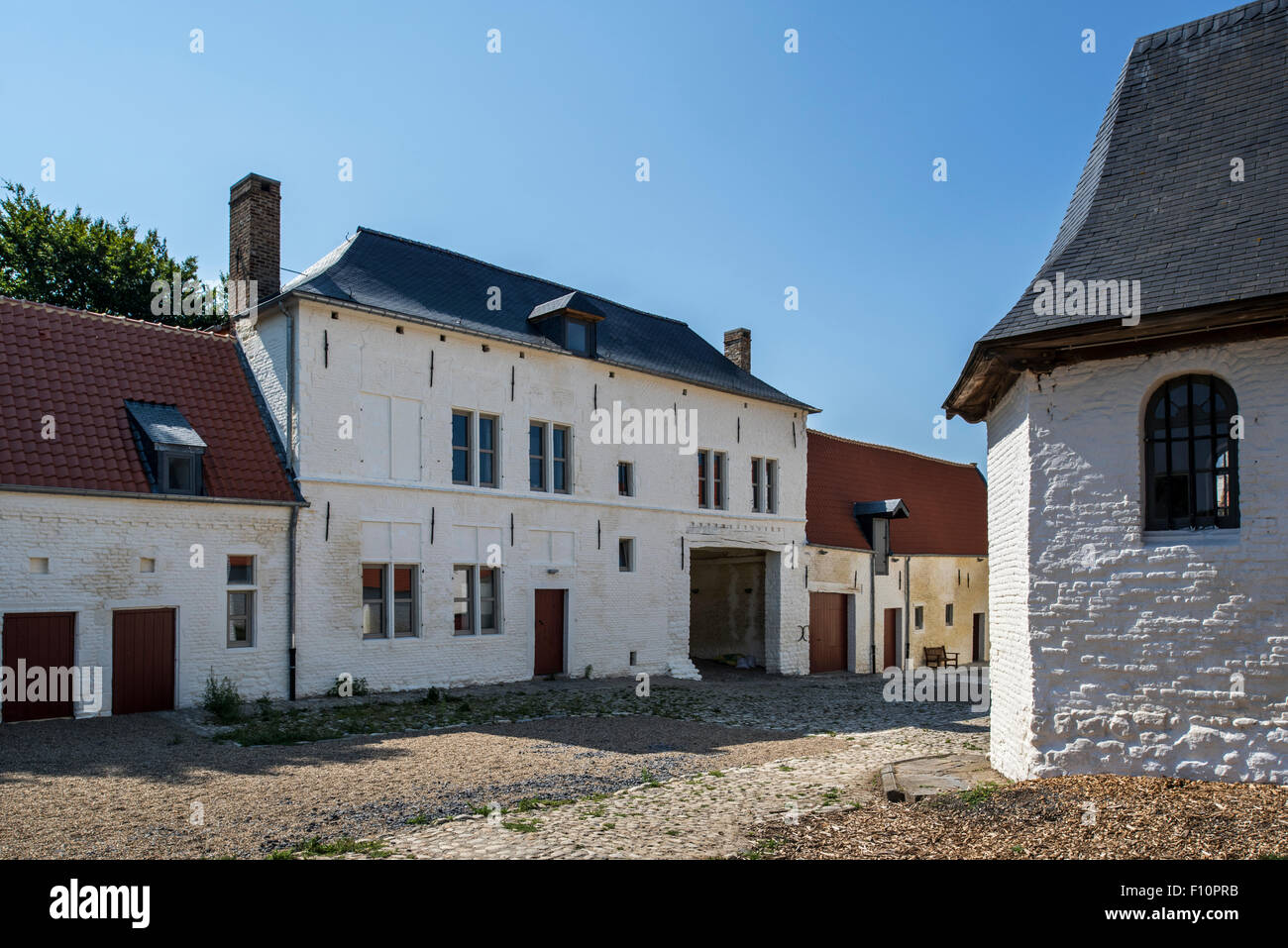 Courtyard showing chapel and gardener’s house of Château de Hougoumont, where British soldiers faced Napoleon's Army at Waterloo Stock Photo