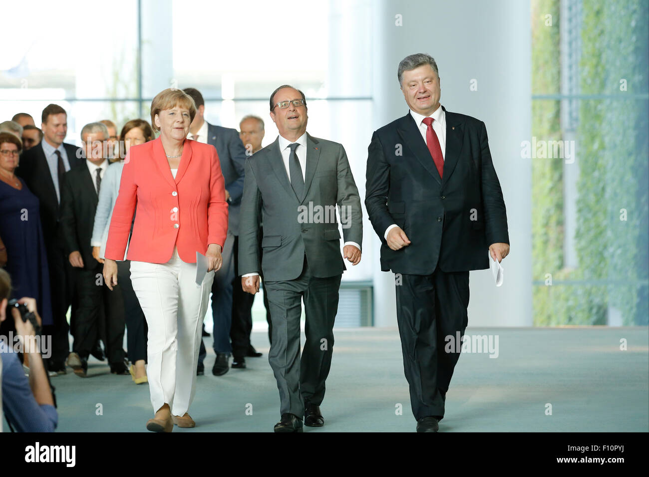 Berlin, Germany. 24th Aug, 2015. German Chancellor Angela Merkel, French president François Hollande and Ukrainian president Petro Poroschenko give a joint press conference after meeting at the German Chancellery in Berlin Germany on 24 August 2015. / Picture: François Hollande, French president and Angela Merkel, German Chancellor and Petro Poroschenko, Ukrainian president Credit:  Reynaldo Chaib Paganelli/Alamy Live News Stock Photo