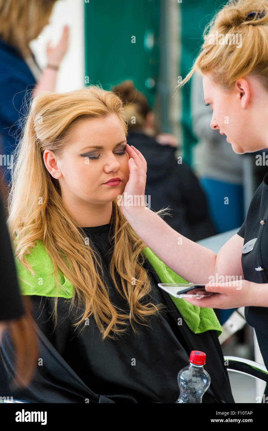 Vocational Education UK: Teenage girls from Coleg Ceredigion competing in the Hairdressing and Beauty vocational training category at the URDD national eisteddfod of Wales, May 2015 Stock Photo