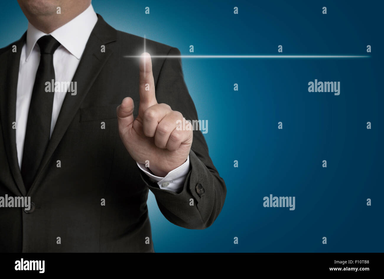 touchscreen is operated by businessman concept. Stock Photo