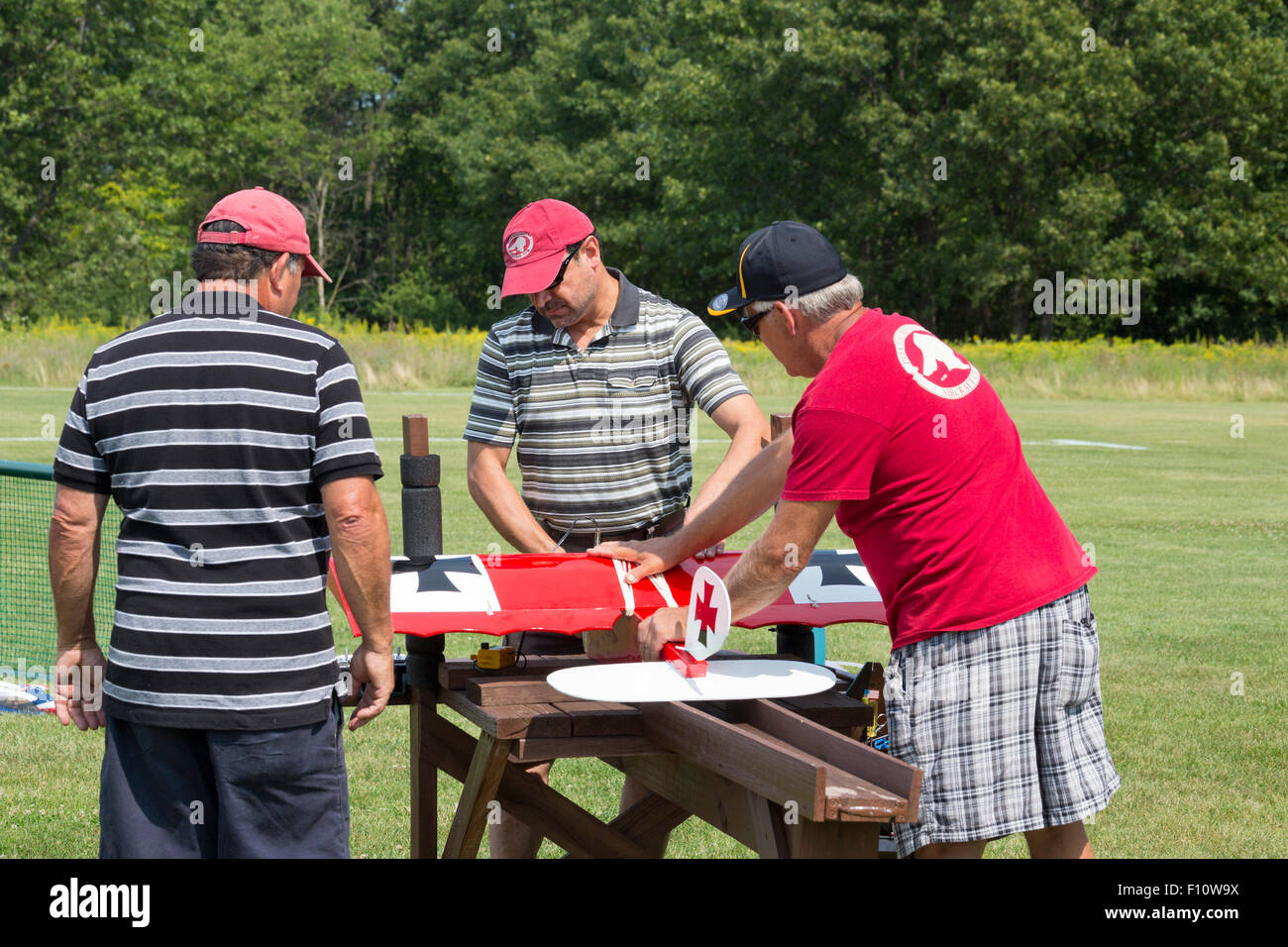 White Lake, Michigan - Members of the Pontiac Miniature Aircraft Club prepare a remote controlled airplanes for flight. Stock Photo