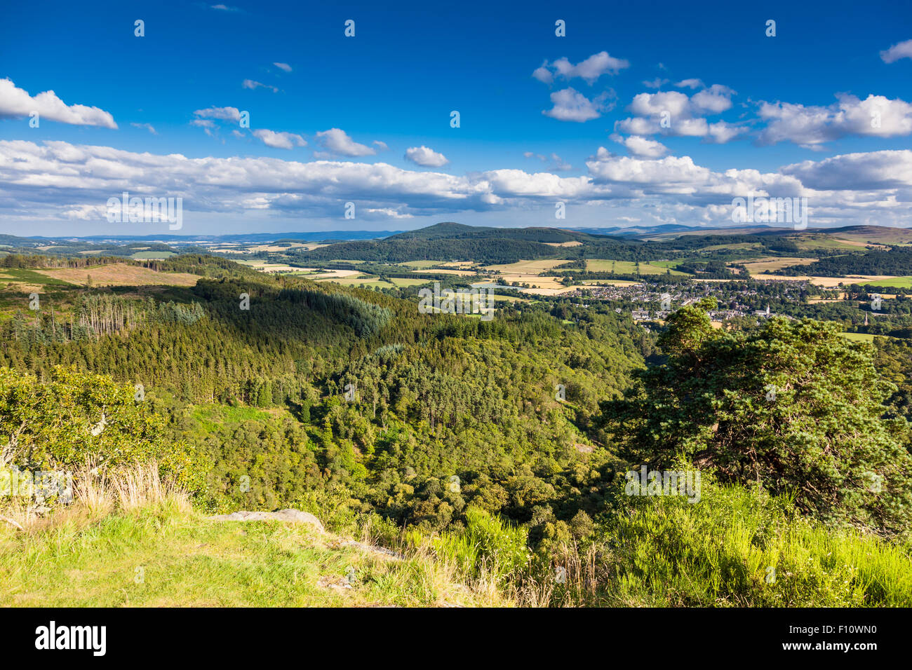 Comrie nestling in the Strathearn Valley, seen from Dun More Hill, Comrie, Perthshire, Scotland, UK Stock Photo