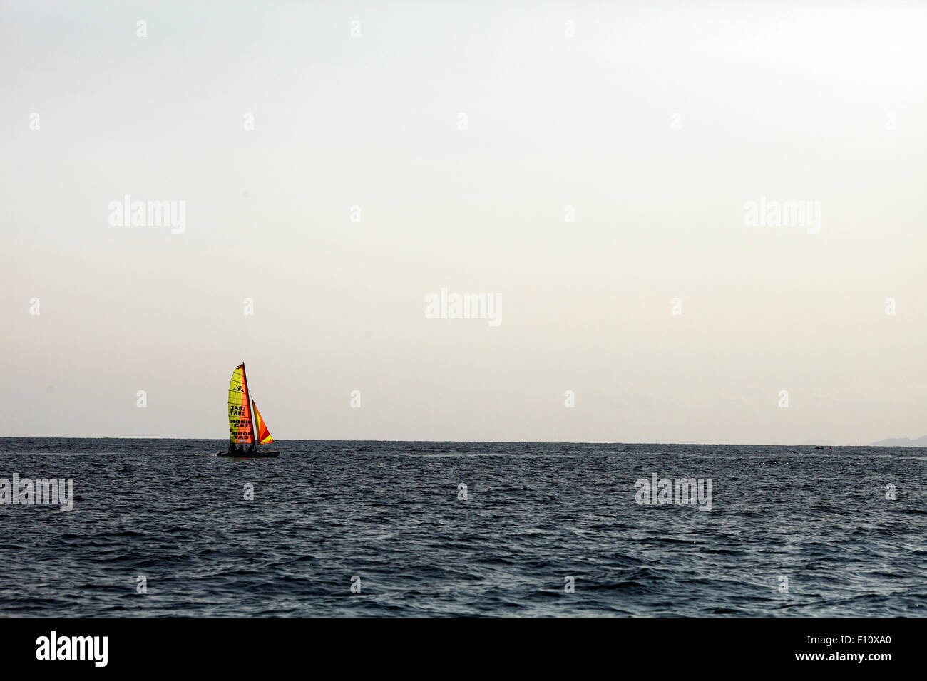 Hobie Cat  silhouetted against the skyline Stock Photo
