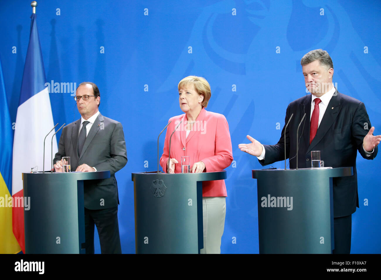 Berlin, Germany. 24th Aug, 2015. German Chancellor Angela Merkel, French president François Hollande and Ukrainian president Petro Poroschenko give a joint press conference after meeting at the German Chancellery in Berlin Germany on 24 August 2015. / Picture: François Hollande, French president and Angela Merkel, German Chancellor and Petro Poroschenko, Ukrainian president Credit:  Reynaldo Chaib Paganelli/Alamy Live News Stock Photo