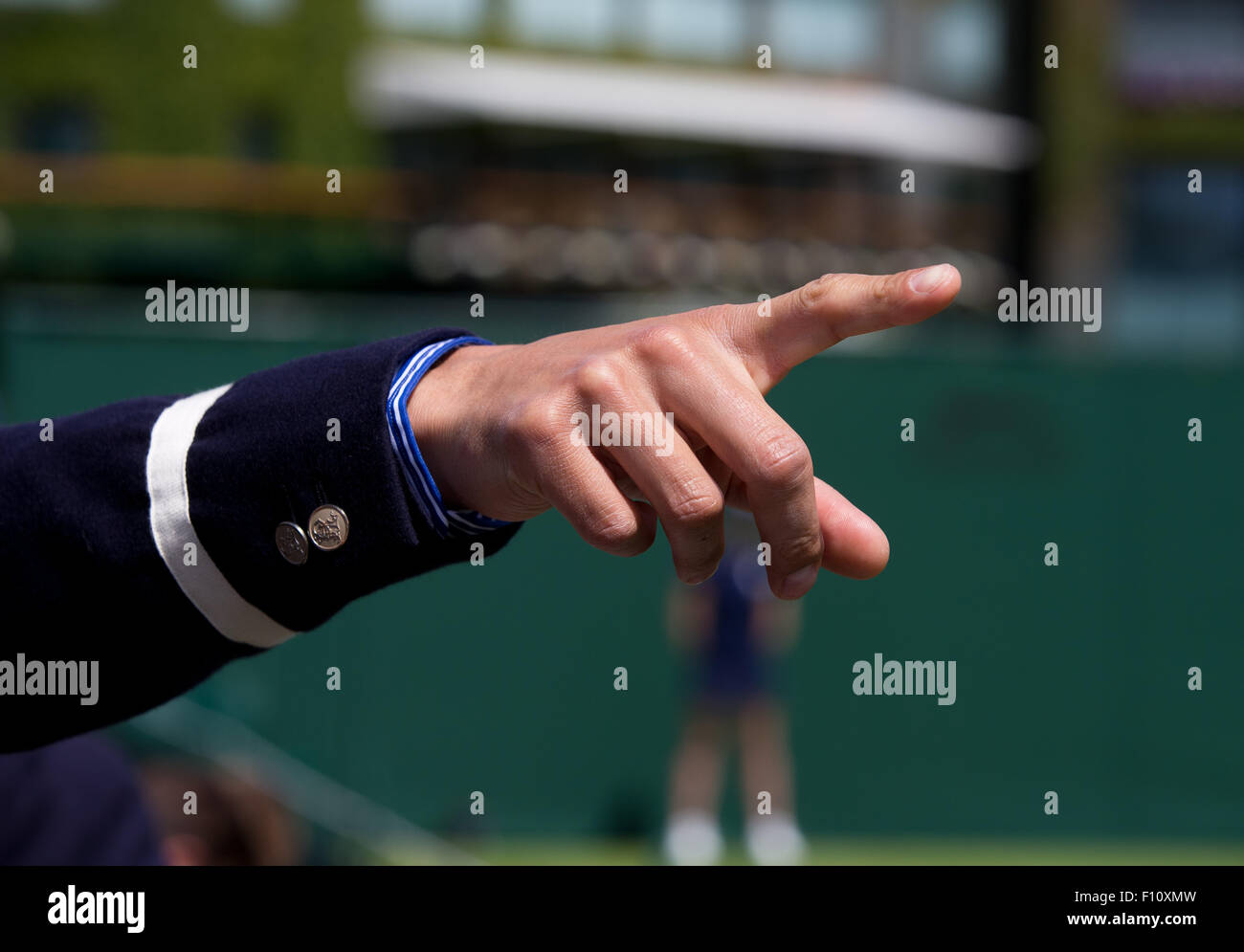 Outstretched hand of a referee at Wimbledon. Stock Photo