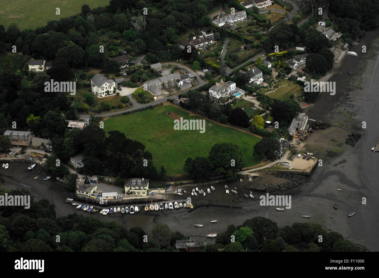 AJAXNETPHOTO. 23RD JULY, 2013. PORT NAVAS, CORNWALL, ENGLAND. - AERIAL VIEW OF THE VILLAGE AND QUAY ON THE HELFORD RIVER. PHOTO:JONATHAN EASTLAND/AJAX REF:D2X 132307 3186 Stock Photo