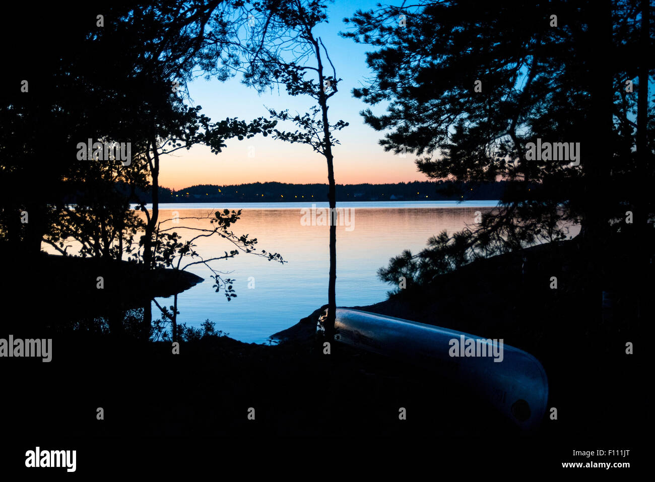 Evening scene with canoe at Lelång Lake, Sweden Stock Photo Alamy