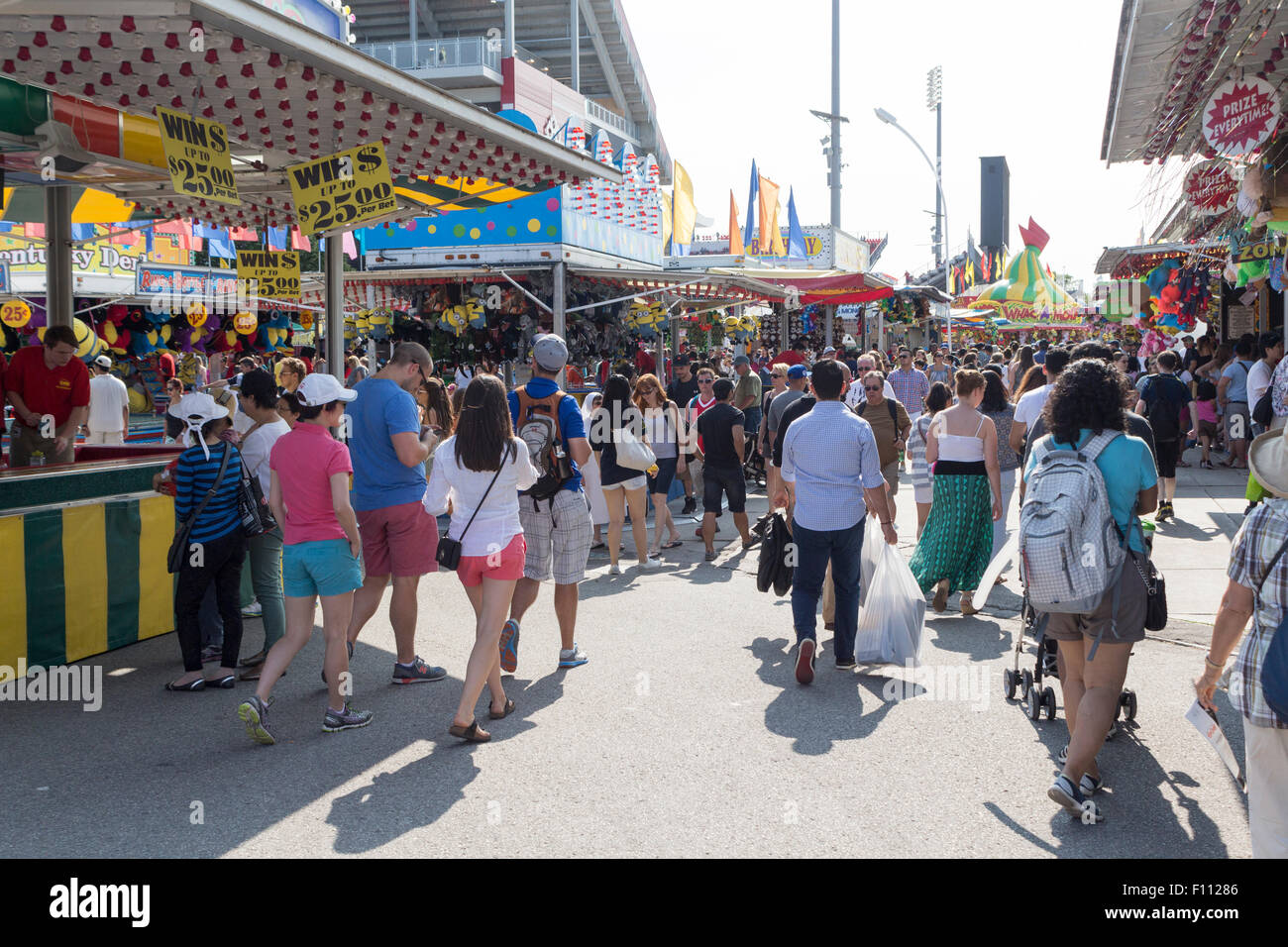 People walking through the Midway at the Canadian National Exhibition in Toronto, Ontario, Canada Stock Photo