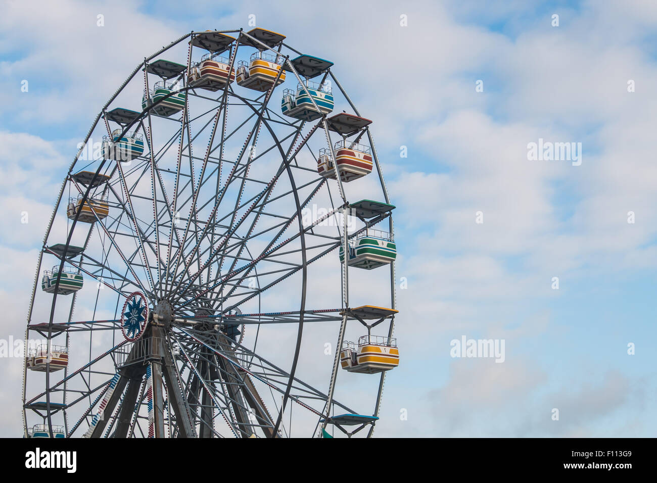 Ferris wheel and cloudy sky Stock Photo - Alamy