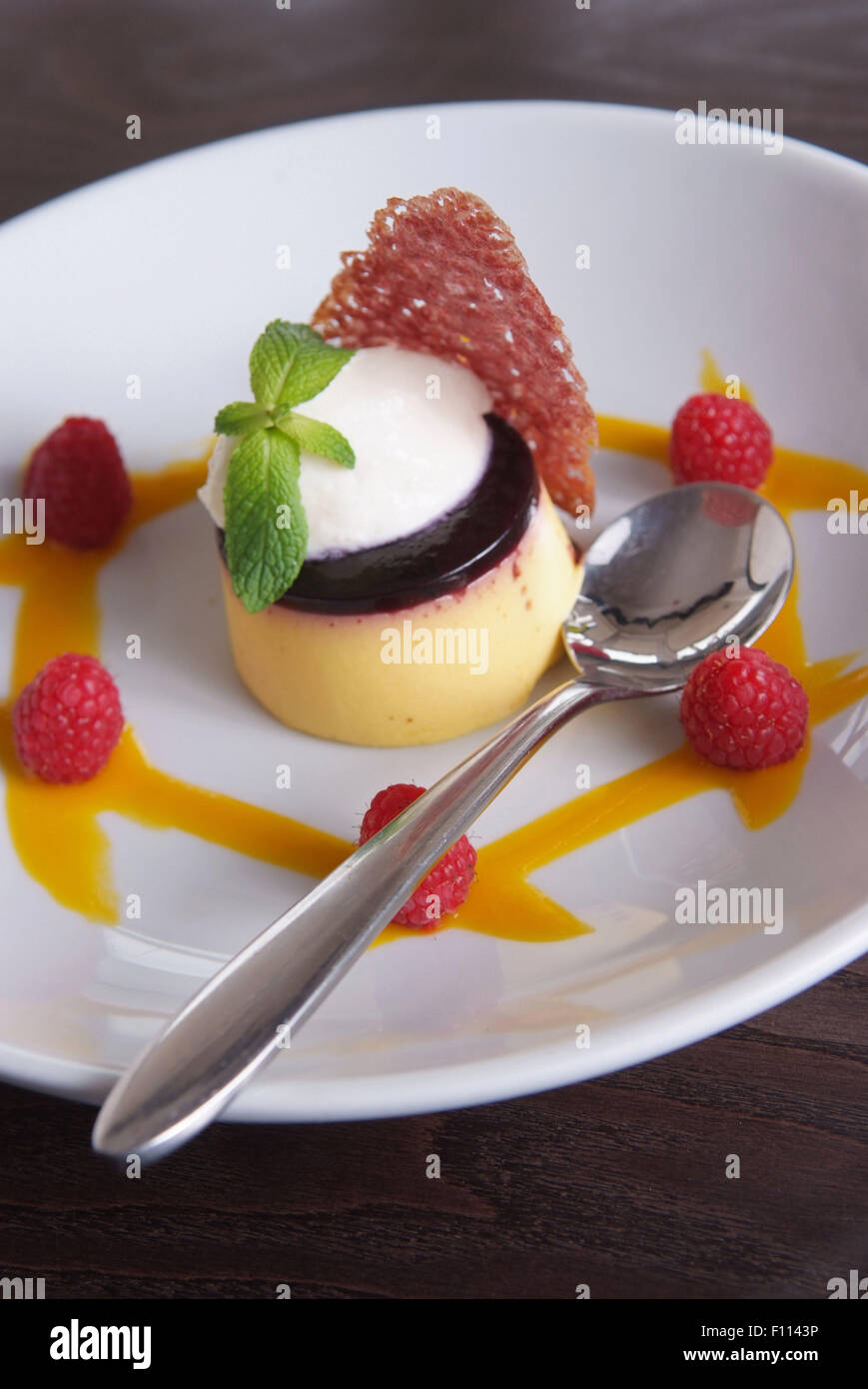 Panna cotta with raspberry coulis Stock Photo Alamy