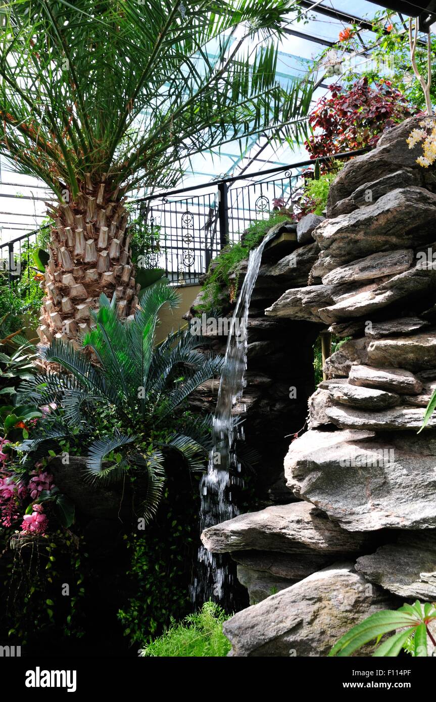 Artificial waterfall in the Inverness Botanic Gardens (formerly Floral Hall), a magnificent public garden in Inverness Stock Photo