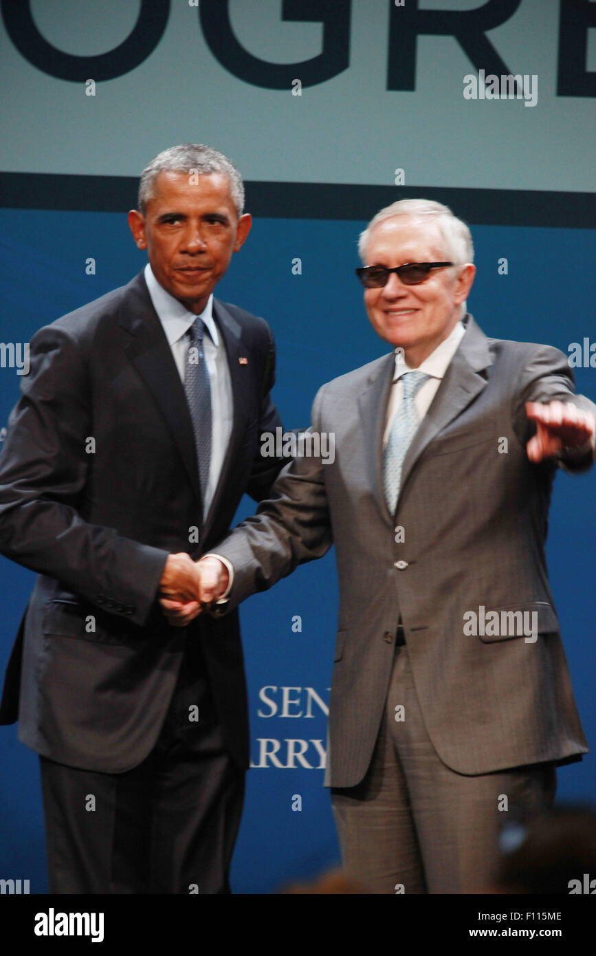 Las Vegas, Nevada, USA. 24th Aug, 2015. President Barack Obama is joined on stage by Senator Harry Reid after delivering the keynote address at the 2015 Clean Energy Summit 8.0 on August 24, 2015 at Mandalay Bay Convention Center in Las Vegas, Nevada. Credit:  Marcel Thomas/ZUMA Wire/Alamy Live News Stock Photo