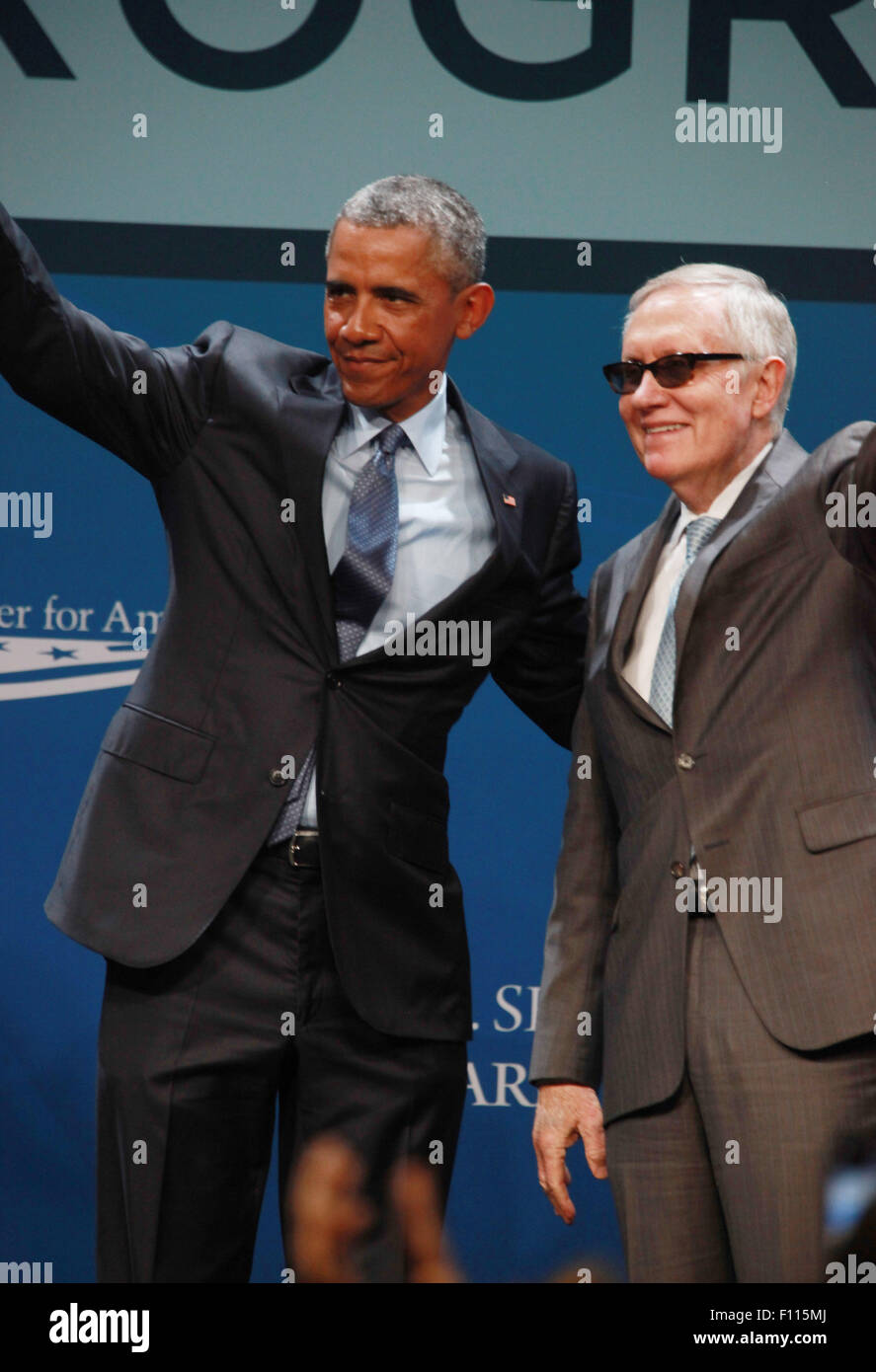 Las Vegas, Nevada, USA. 24th Aug, 2015. President Barack Obama is joined on stage by Senator Harry Reid after delivering the keynote address at the 2015 Clean Energy Summit 8.0 on August 24, 2015 at Mandalay Bay Convention Center in Las Vegas, Nevada. Credit:  Marcel Thomas/ZUMA Wire/Alamy Live News Stock Photo