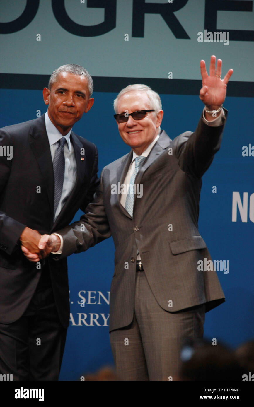 Las Vegas, Nevada, USA. 24th Aug, 2015. President Barack Obama is joined on stage by Senator Harry Reid after delivering the keynote address at the 2015 Clean Energy Summit 8.0 on August 24, 2015 at Mandalay Bay Convention Center in Las Vegas, Nevada. Credit:  Marcel Thomas/ZUMA Wire/Alamy Live News Stock Photo