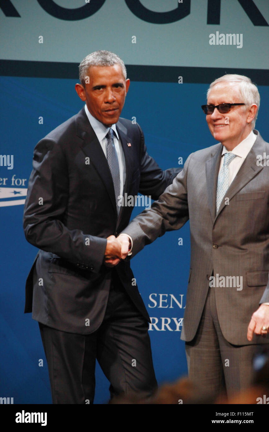 Las Vegas, Nevada, USA. 24th Aug, 2015. President Barack Obama is joined on stage by Senator Harry Reid after delivering the keynote address at the 2015 Clean Energy Summit 8.0 on August 24, 2015 at Mandalay Bay Convention Center in Las Vegas, Nevada. Credit:  Marcel Thomas/ZUMA Wire/Alamy Live News Stock Photo
