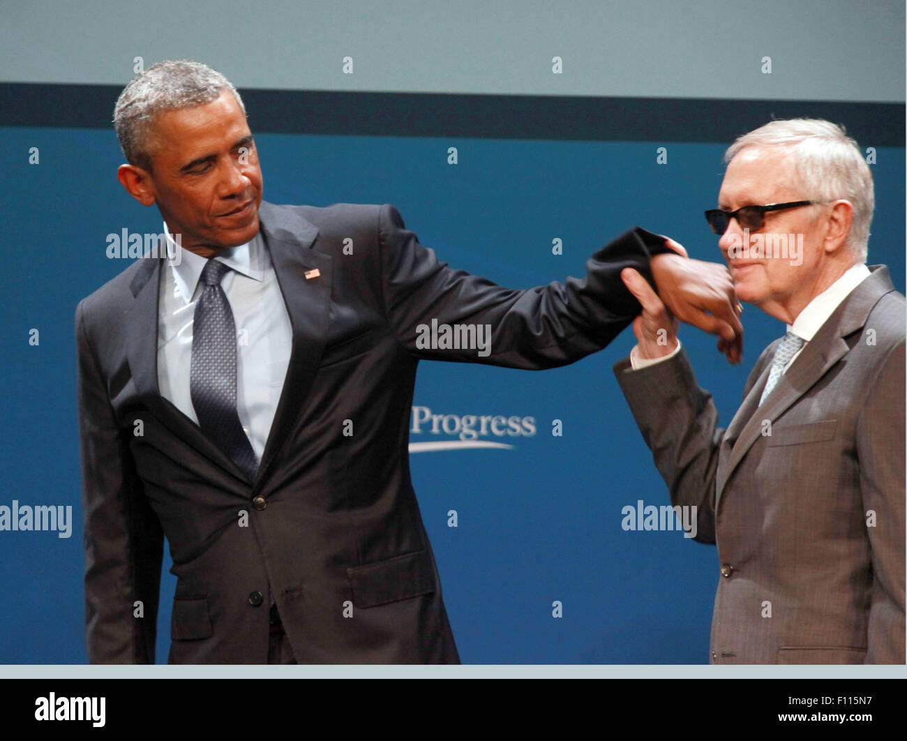 Las Vegas, Nevada, USA. 24th Aug, 2015. President Barack Obama is joined on stage by Senator Harry Reid after delivering the keynote address at the 2015 Clean Energy Summit 8.0 on August 24, 2015 at Mandalay Bay Convention Center in Las Vegas, Nevada. Credit:  Marcel Thomas/ZUMA Wire/Alamy Live News Stock Photo