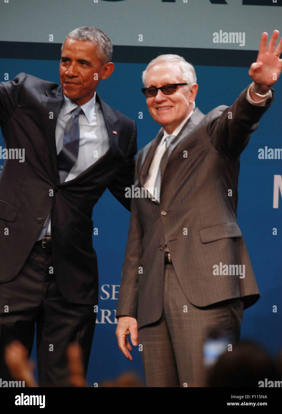 Las Vegas, Nevada, USA. 24th Aug, 2015. President Barack Obama is joined on stage by Senator Harry Reid after delivering the keynote address at the 2015 Clean Energy Summit 8.0 on August 24, 2015 at Mandalay Bay Convention Center in Las Vegas, Nevada. Credit:  Marcel Thomas/ZUMA Wire/Alamy Live News Stock Photo