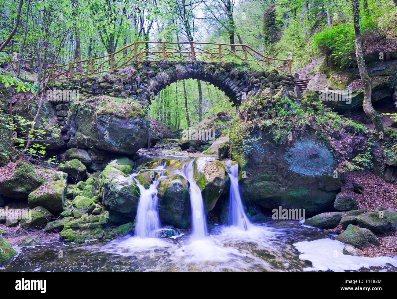 The Schiessentumpel waterfall and bridge in the Mullerthal Region in Luxembourg Stock Photo