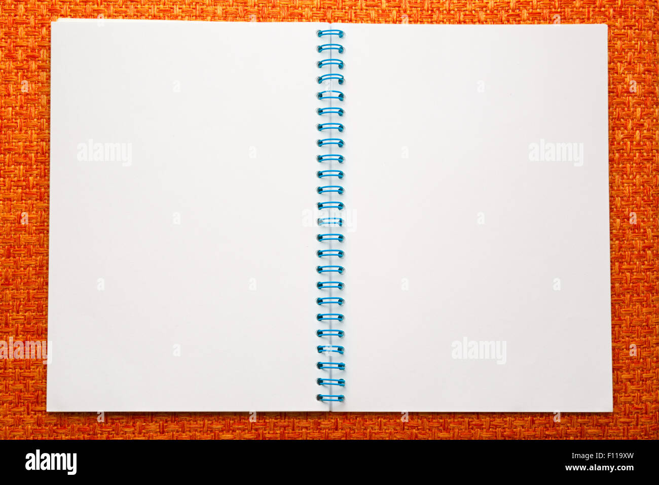 Blank open notepad on the orange background Stock Photo Alamy