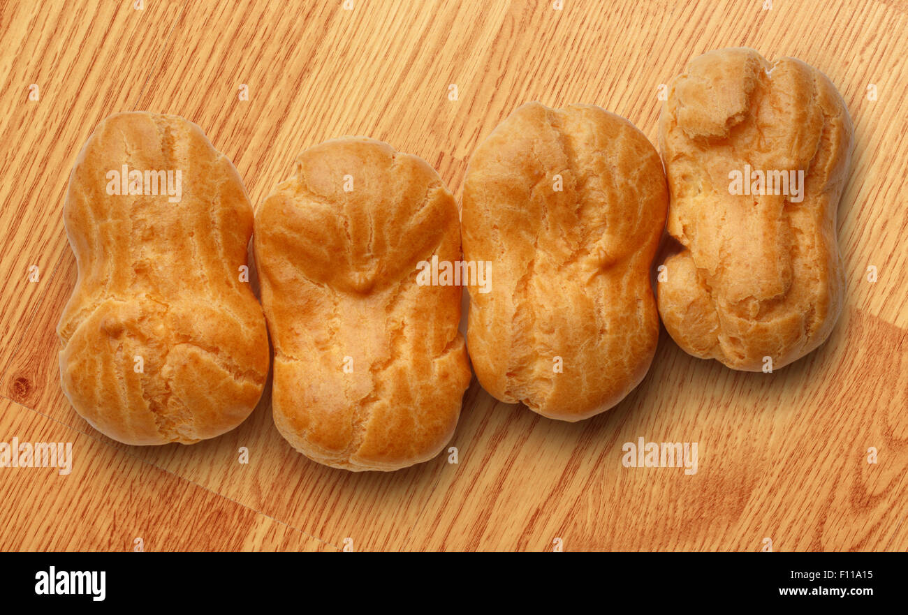 Pastry dough eclairs with vanilla cream inside Stock Photo Alamy