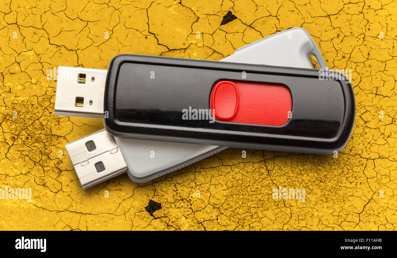 Usb flash drives on the cracked background Stock Photo Alamy