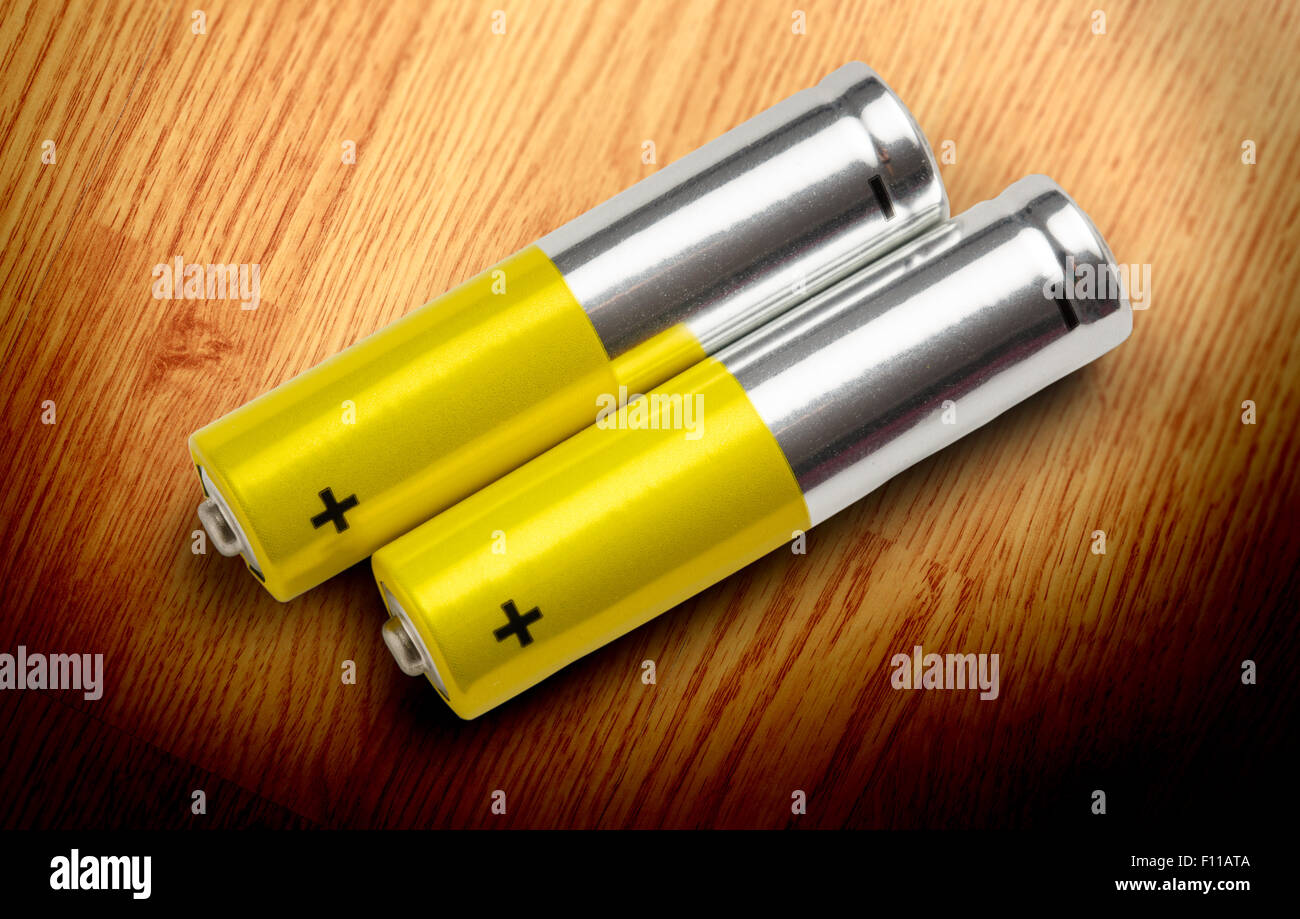 Two batteries with plus sign visible in closeup Stock Photo Alamy